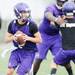 Pioneer High School's Brandon Bertora looks to throw the ball during the first day of practice on Monday, August 12, 2013. Melanie Maxwell | AnnArbor.com